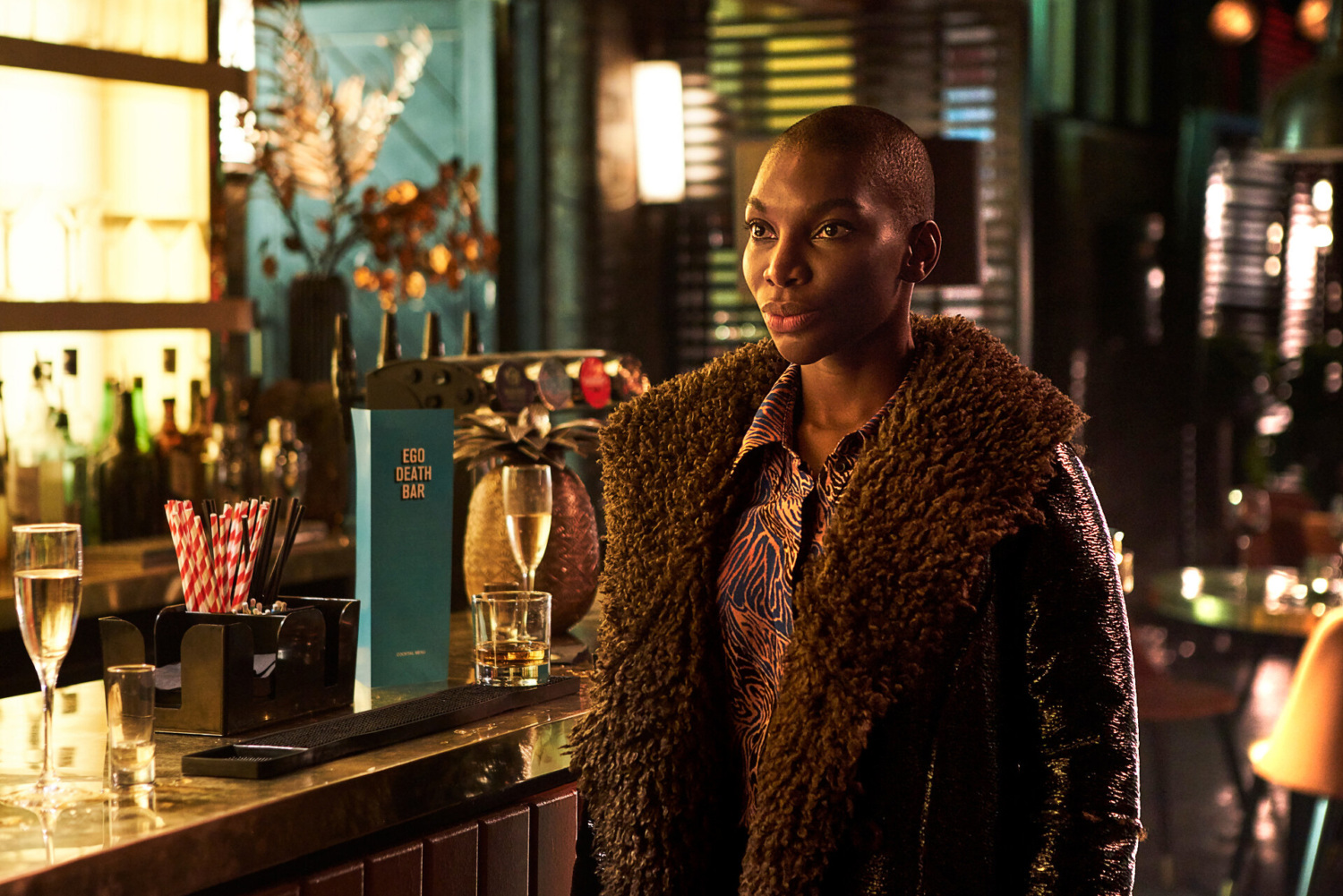Michaela Coel in a dimly lit bar in 'I May Destroy You'