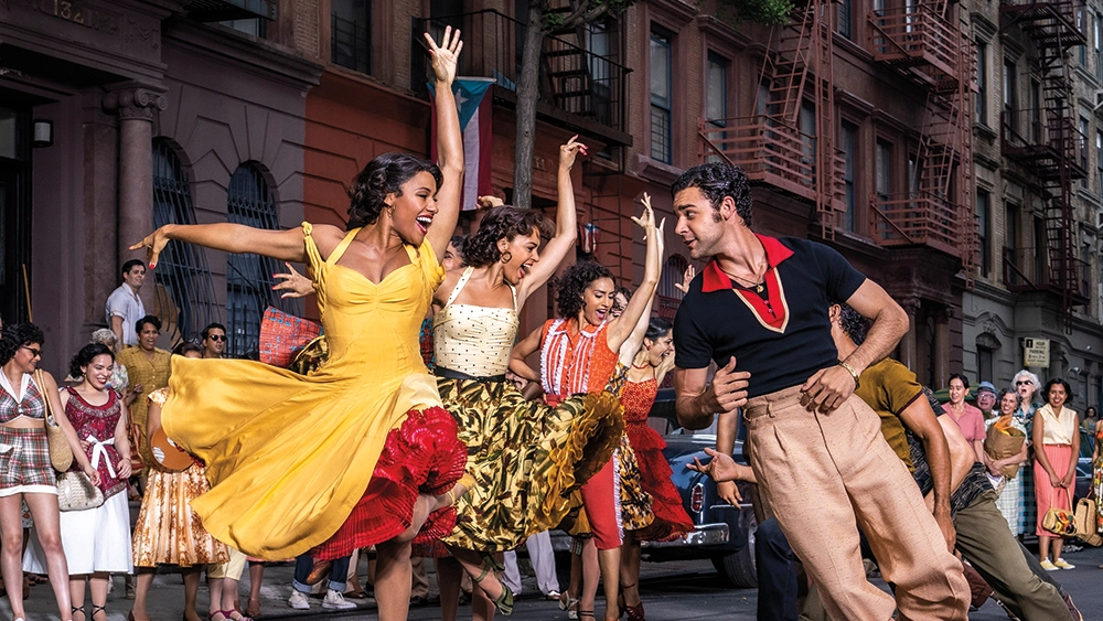 Characters dancing in the street in West Side Story