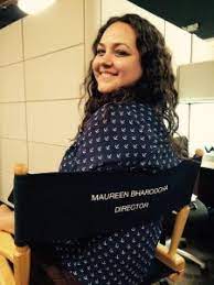 Maureen Bharoocha in a director's chair with her name on the back