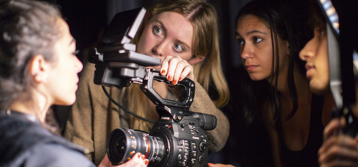 Three young filmmakers capturing a shot